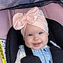 baby, baby_girl, blue_eyes, car_seat, child, closeup, clothing, cute, fabric, happy, headwear, indoor, infant, pink_bow, portrait, safety, seat, seat_belt, smiling, straps