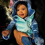 Kamren joined the competition — help win amazing prizes! baby, child, costume, blue, ears, smile, happy, person, hand, night, outdoor, cute, hood, jacket, face, clothing, holding, dark, portrait, infant