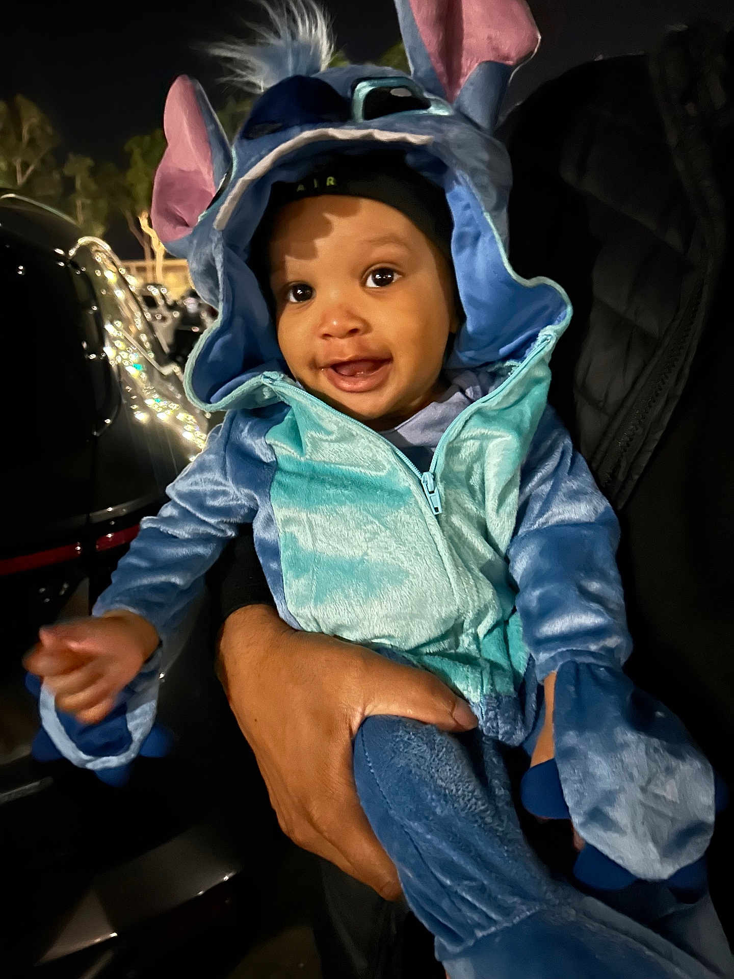 Kamren joined the competition — help win amazing prizes! baby, child, costume, blue, ears, smile, happy, person, hand, night, outdoor, cute, hood, jacket, face, clothing, holding, dark, portrait, infant