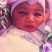 Legacy is registered to the contest to win money with this photo: anemone, baby, bonnet, cap, clothing, face, flower, flowerarrangement, flowerbouquet, hat, head, newborn, people, person, petal, photography, plant, portrait, purple, rose
