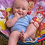 baby, child, outdoor, grass, chair, paw_patrol, blue_onesie, smiling, happy, foot, hand, head, face, toy_chair, colorful, sunlight, nature, cute, infant, playful