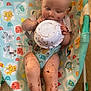 animal_print, baby, baby_chair, bowl, child, chocolate, cute, eating, face, feet, floor, food, hands, happy, highchair, indoor, infant, legs, messy, playful