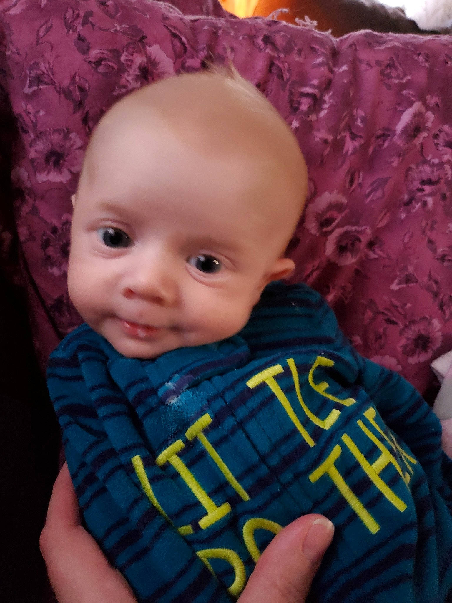 Jameson is registered to the contest to win money with this photo: baby, cheek, child, chin, design, ear, eye, face, forehead, head, iris, lip, mouth, nose, pattern, person, pink, plaid, skin, textile