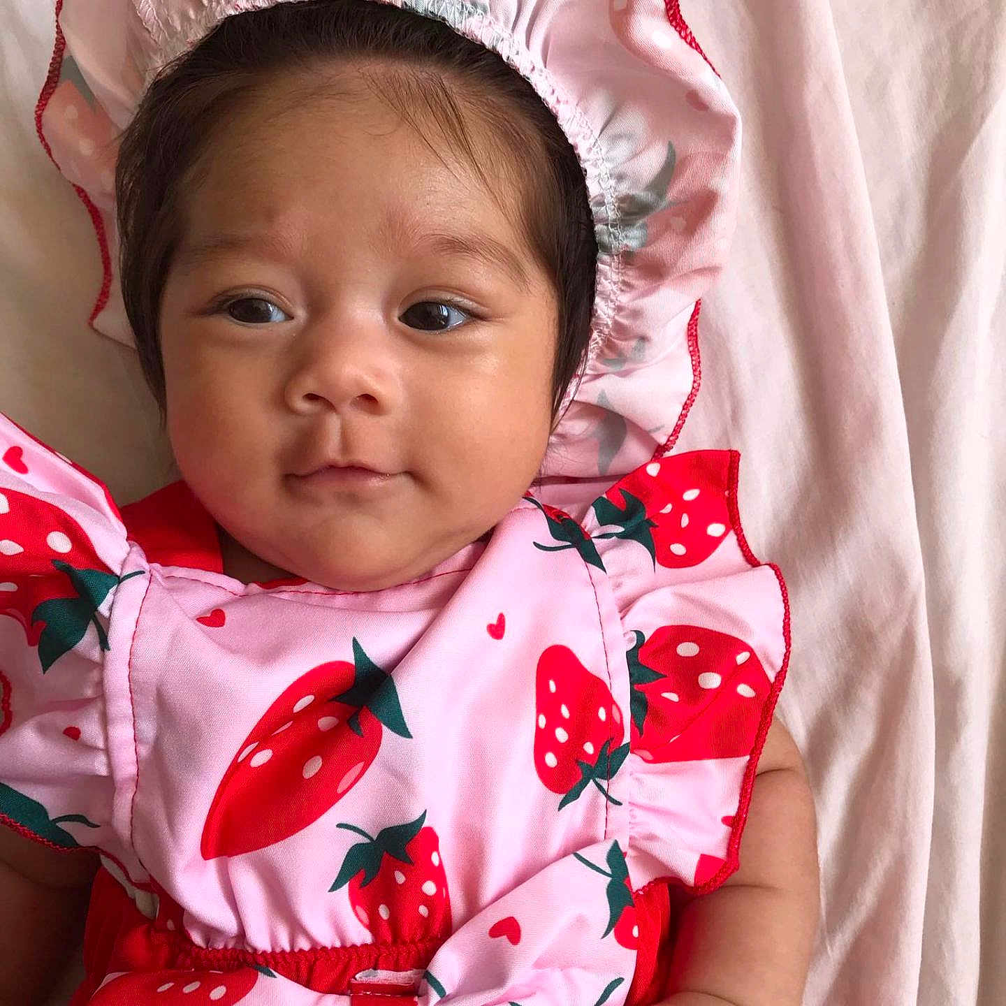 Maria participe au concours pour gagner de l'argent avec cette photo : baby, bed, blanket, bonnet, clothing, coat, dress, face, happy, hat, head, hood, newborn, pajamas, person, photography, portrait, sleeping, sleeve, smile