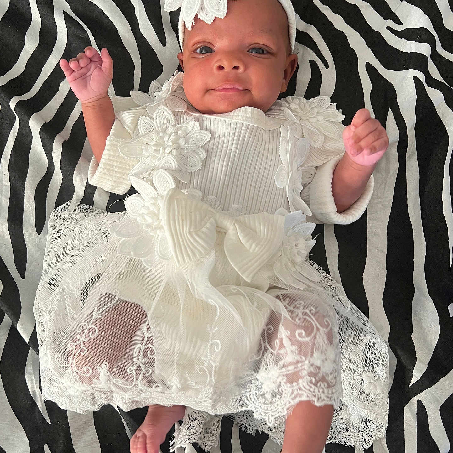 Harmani is registered to the contest to win money with this photo: baby, bodypart, bonnet, cap, clothing, costume, dress, face, finger, formalwear, furniture, hand, hat, head, lace, newborn, person, photography, portrait, sitting