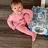 Eliza is registered to the contest to win money with this photo: toddler, child, pacifier, pink_pajamas, flooring, wood_floor, bottled_water, water_pack, sitting, indoors, baby, curious, young_child, person, casual, home, light_skin, short_hair, blue_eyes, floor