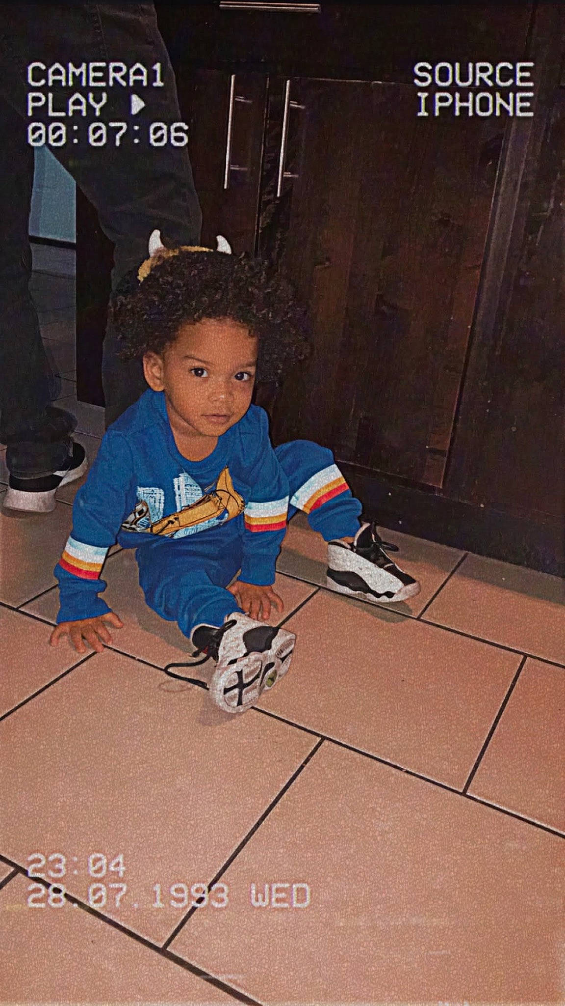 Emilio joined the competition — help win amazing prizes! audio_equipment, carmine, child, door, electric_blue, flooring, font, fun, games, knee, pattern, person, play, recreation, sitting, t_shirt, toddler, toy, wood