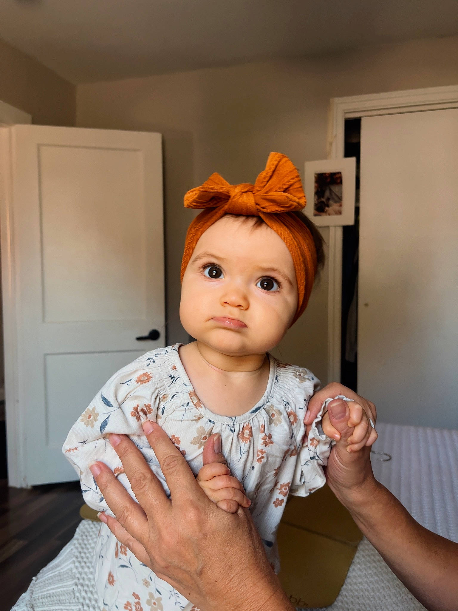 Aubrey is registered to the contest to win money with this photo: baby, baby_toddler_clothing, chair, cheek, child, door, fashion_design, flash_photography, fun, gesture, happy, headwear, nail, peach, person, portrait_photography, room, shoulder, sitting, sleeve