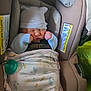baby, newborn, car_seat, blanket, hat, sleeping, infant, child, clothing, pacifier, evenflo, safety, cute, cozy, indoor, portrait, resting, wrapped, small, peaceful