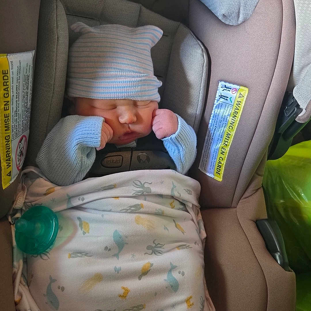 Spencer joined the competition — help win amazing prizes! baby, blanket, car_seat, child, clothing, cozy, cute, evenflo, hat, indoor, infant, newborn, pacifier, peaceful, portrait, resting, safety, sleeping, small, wrapped