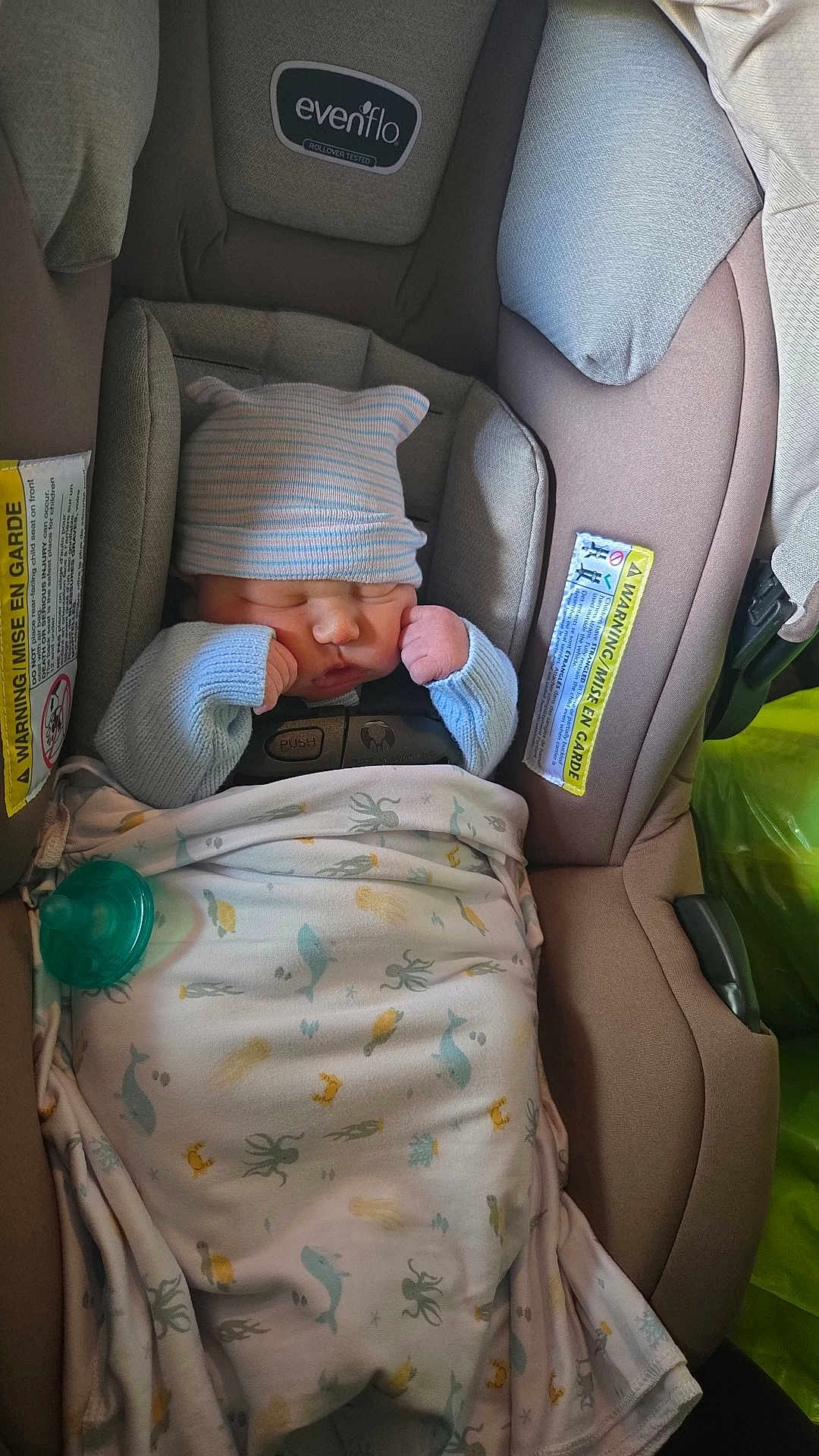 Spencer joined the competition — help win amazing prizes! baby, newborn, car_seat, blanket, hat, sleeping, infant, child, clothing, pacifier, evenflo, safety, cute, cozy, indoor, portrait, resting, wrapped, small, peaceful