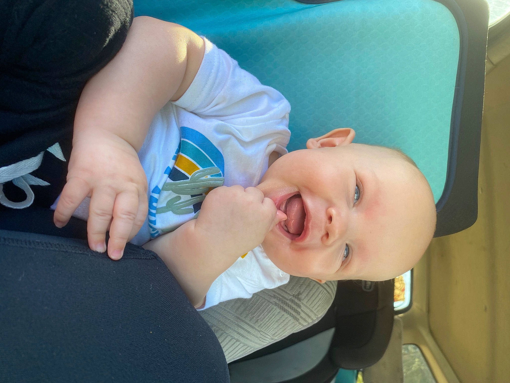 Jackson is registered to the contest to win money with this photo: baby, cheek, child, comfort, elbow, electric_blue, eye, facial_expression, finger, fun, gesture, happy, human_body, mouth, neck, nose, person, sitting, skin, smile