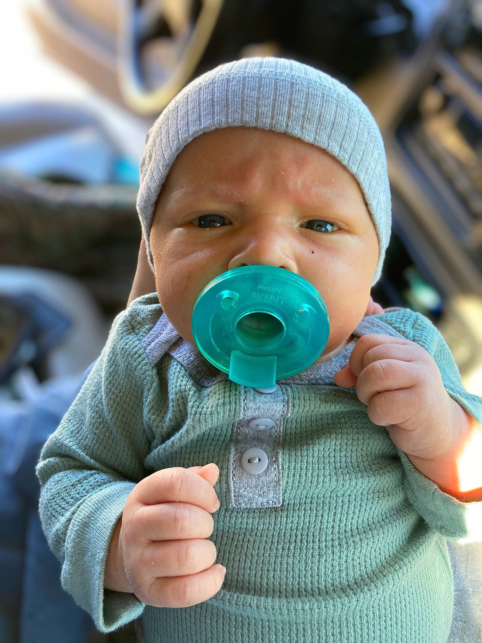 Jackson is registered to the contest to win money with this photo: baby, baby_products, baby_safety, baby_toddler_clothing, cheek, child, cool, drinkware, eye, eyelash, facial_expression, finger, headgear, headwear, jacket, nose, outerwear, person, personal_protective_equipment, skin
