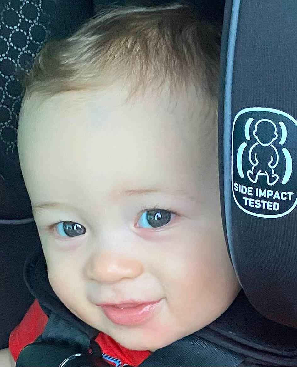 Kingston is registered to the contest to win money with this photo: automotive_tire, baby, cheek, chin, cool, ear, eye, eyebrow, eyelash, flash_photography, hair, happy, iris, jaw, lip, mouth, nose, person, skin, smile