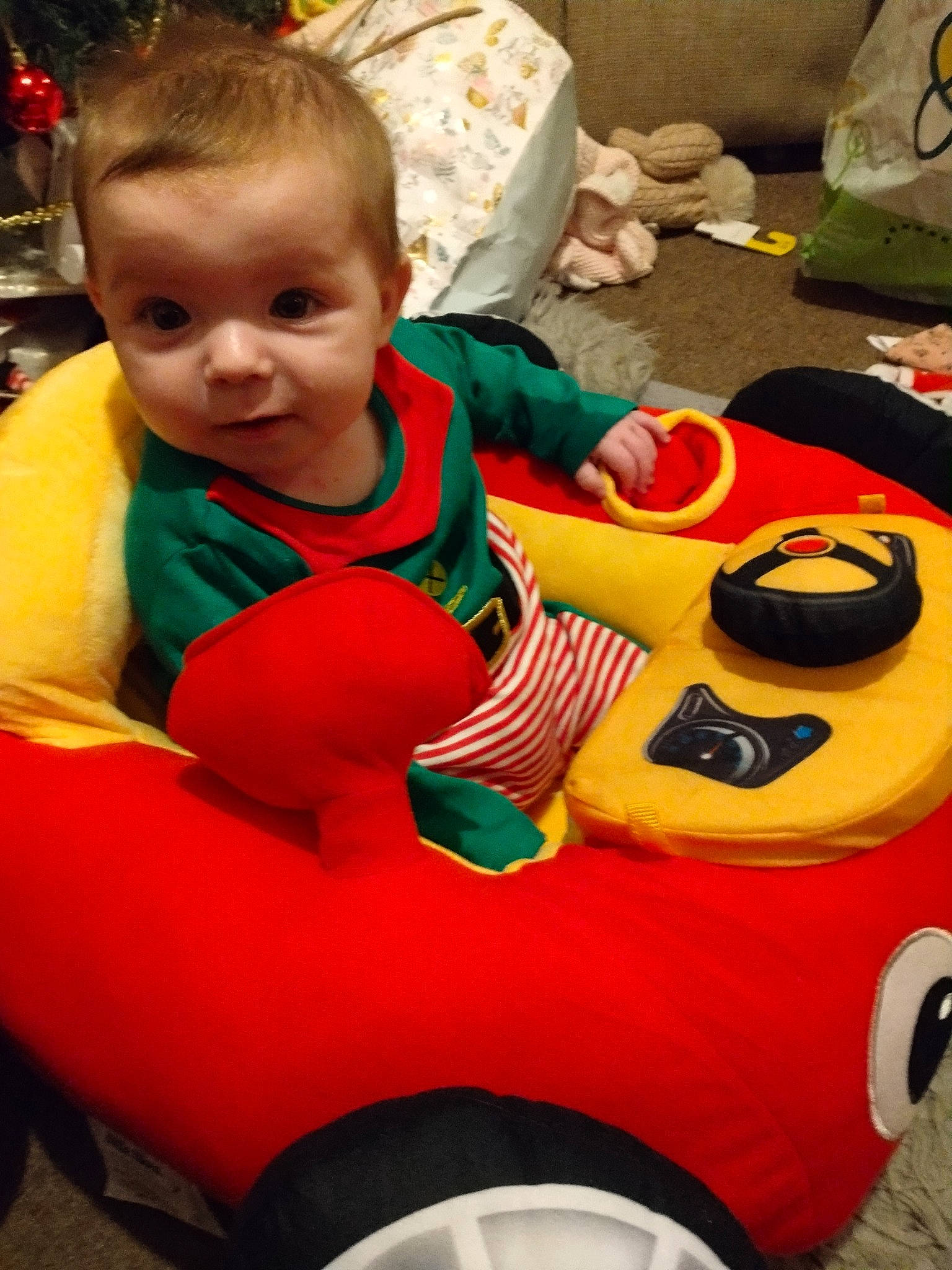 Ellie joined the competition — help win amazing prizes! automotive_design, automotive_tire, baby, baby_toddler_clothing, child, face, facial_expression, fun, hairstyle, happy, human_body, leisure, motor_vehicle, orange, person, product, recreation, riding_toy, tire, toddler