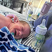 Apollo joined the competition — help win amazing prizes! baby, infant, smiling, bed, blanket, bottle, nursery, pillow, striped, sleeping, pacifier, newborn, child, cute, happy, resting, indoor, person, soft, comfort