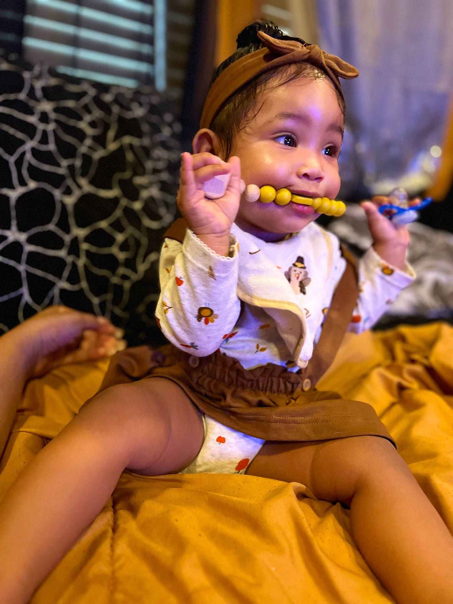 Symphony is registered to the contest to win money with this photo: baby, baby_toddler_clothing, child, entertainment, event, finger, fun, goggles, happy, hat, jewellery, leisure, performing_arts, person, purple, sitting, skin, sunglasses, thigh, toddler