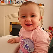 Sonya joined the competition — help win amazing prizes! baby, child, smiling, pink_sweatshirt, high_chair, indoor, toys, cartoon_character, happy, face, person, clothing, home, furniture, cute, infant, table, sitting, young_child, portrait
