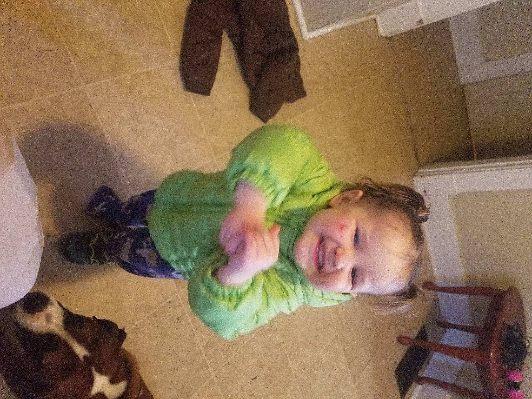 Miley is registered to the contest to win money with this photo: baby, chair, child, comfort, floor, flooring, foot, fun, grass, happy, hardwood, head, joy, leg, mammal, person, room, sitting, smile, sock