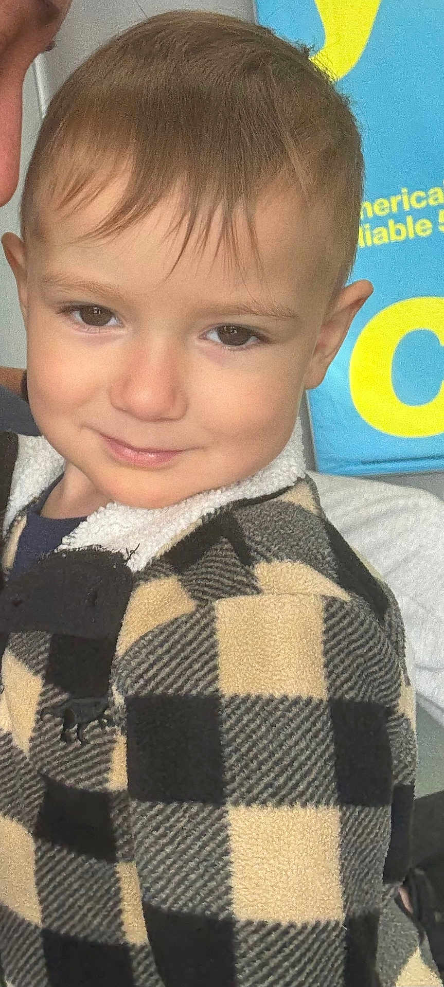 Dylan Joseph is registered to the contest to win money with this photo: brown_hair, checkered, child, closeup, clothing, cute, expression, eyes, face, fashion, happy, head, indoor, jacket, person, portrait, skin, smile, warm, young