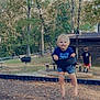 barefoot, child, clothing, fun, grass, happy, nature, outdoor, park, picnic_table, play, playground, recreation, smile, summer, sunlight, swing, toddler, trees, wooden_shelter