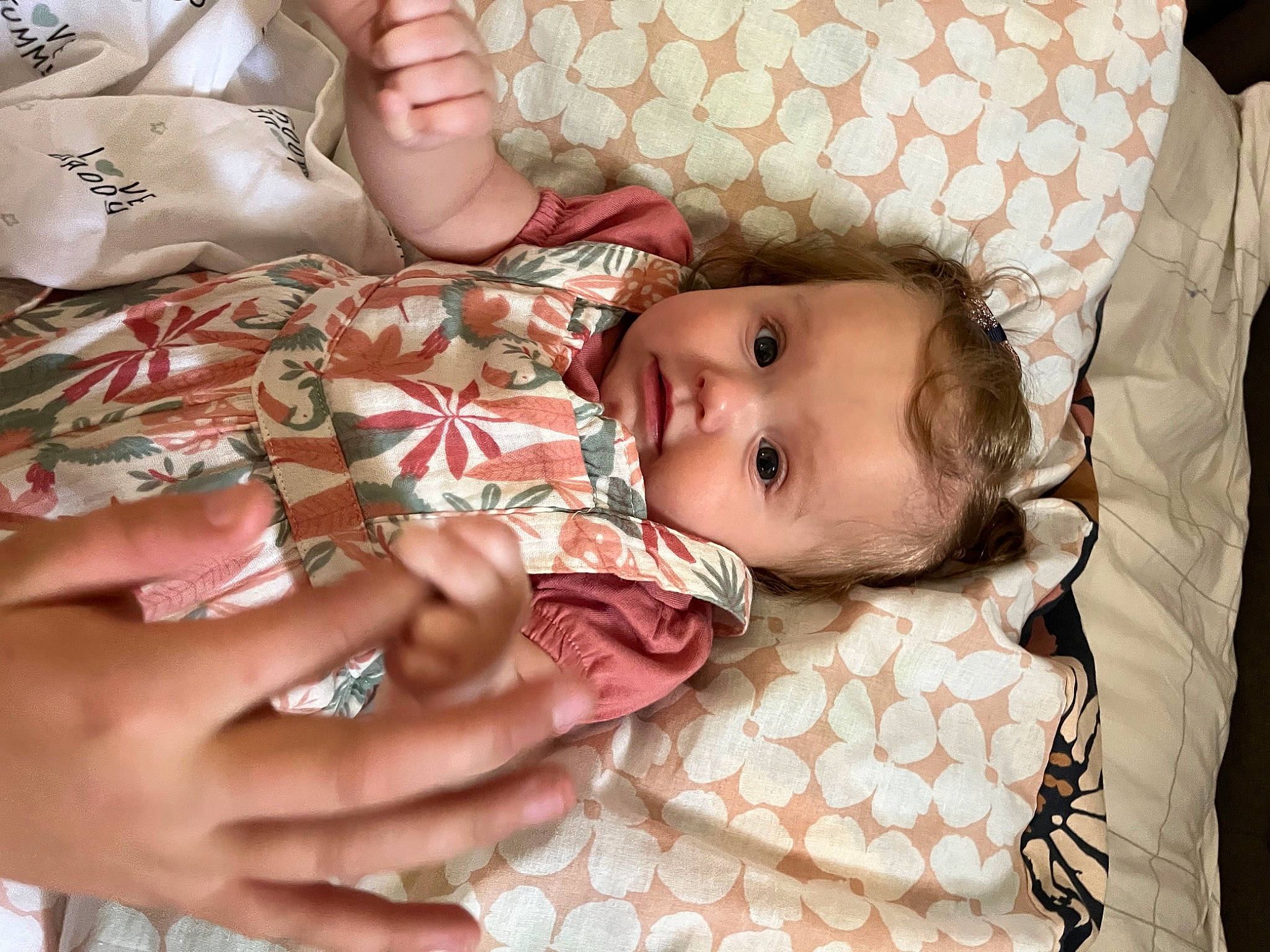 Lily joined the competition — help win amazing prizes! baby, baby_products, baby_toddler_clothing, cheek, child, comfort, couch, eye, eyelash, finger, gesture, hand, head, lip, nail, pattern, person, skin, textile, thumb