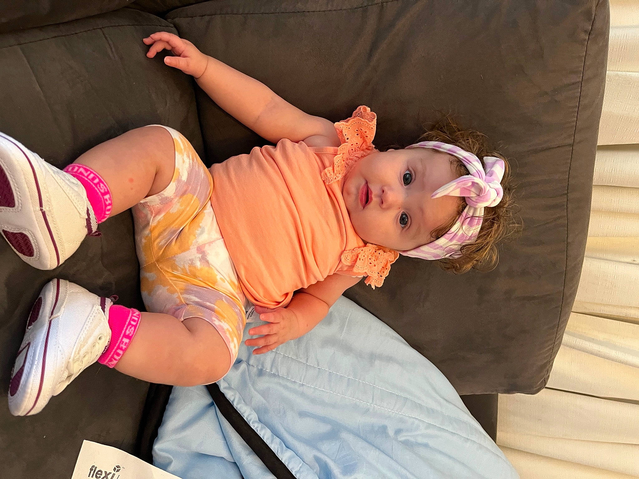 Lily joined the competition — help win amazing prizes! abdomen, baby, baby_toddler_clothing, comfort, foot, hat, headwear, human_leg, joint, knee, leg, magenta, person, pink, sandal, shorts, sitting, skin, smile, thigh