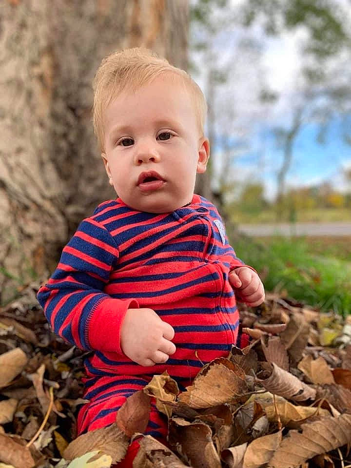 Landen joined the competition — help win amazing prizes! baby, baby_toddler_clothing, child, eye, face, grass, happy, leaf, pattern, people_in_nature, person, plant, sitting, skin, smile, soil, t_shirt, toddler, tree, winter
