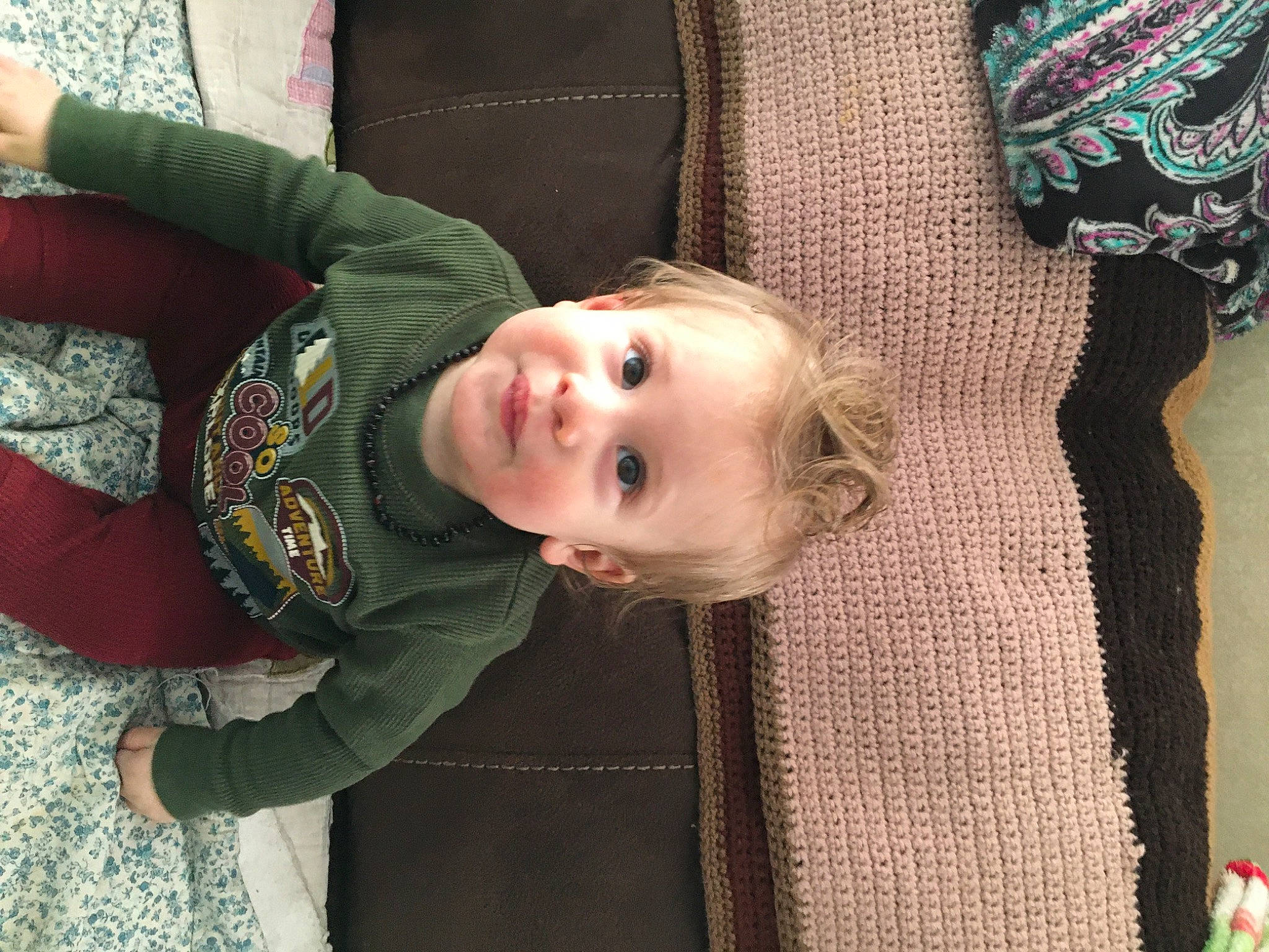 Landen joined the competition — help win amazing prizes! baby, baby_toddler_clothing, cheek, eye, face, green, hairstyle, head, human_body, mammal, nose, outerwear, person, skin, sleeve, smile, standing, textile, toddler, tree