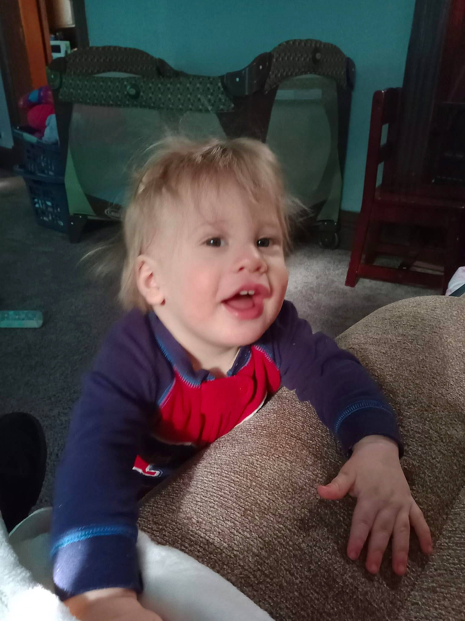 Landen joined the competition — help win amazing prizes! baby_toddler_clothing, black, chair, cheek, child, comfort, floor, flooring, fun, furniture, hair, happy, head, lap, mammal, person, skin, sleeve, smile, toddler