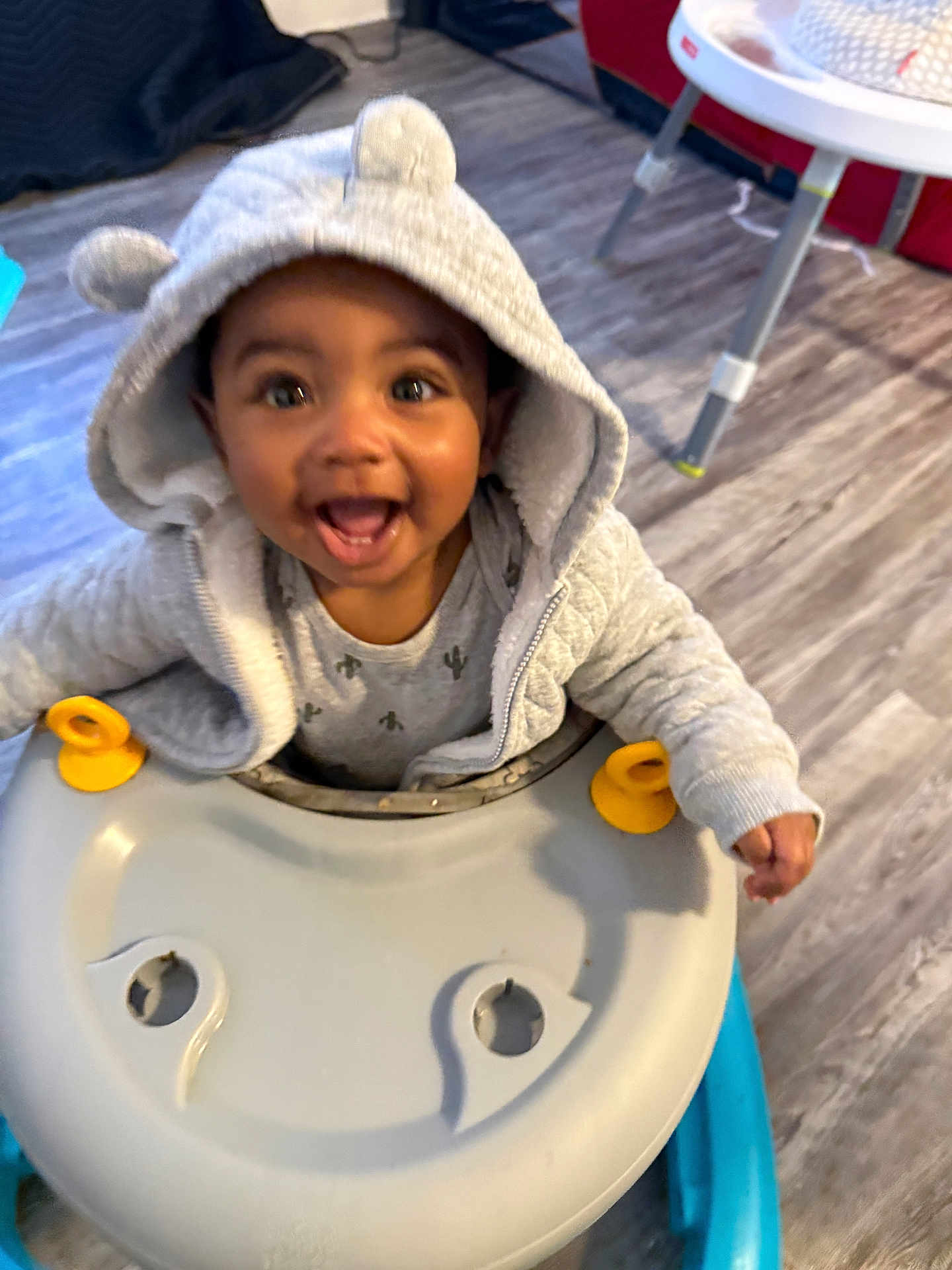 Abel Tru is registered to the contest to win money with this photo: baby, child, hoodie, smiling, walker, indoor, flooring, toy, happy, cute, clothing, person, face, infant, play, home, furniture, joy, hood, ears