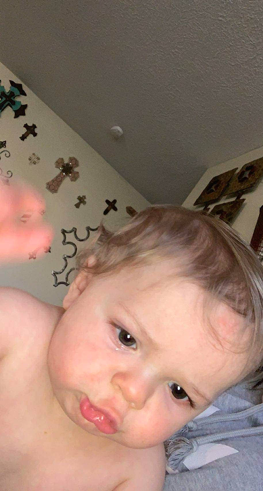 Asher is registered to the contest to win money with this photo: arm, baby, cheek, chest, chin, ear, eyebrow, eyelash, forehead, hair, hairstyle, hand, happy, iris, lip, mouth, neck, nose, person, skin