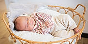 Xanti participe au concours pour gagner de l'argent avec cette photo : baby, basket, blanket, child, comfort, cozy, cute, home, indoor, infant, knit_pants, newborn, peaceful, person, resting, sleep, sleeping, soft_texture, striped_clothing, wooden_basket