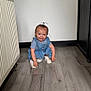 Paisley joined the competition — help win amazing prizes! toddler, child, indoor, floor, wooden_floor, radiator, cabinet, blue_dress, white_bow, shoes, playful, smiling, crouching, person, young_child, home, light, skin, hair, cute