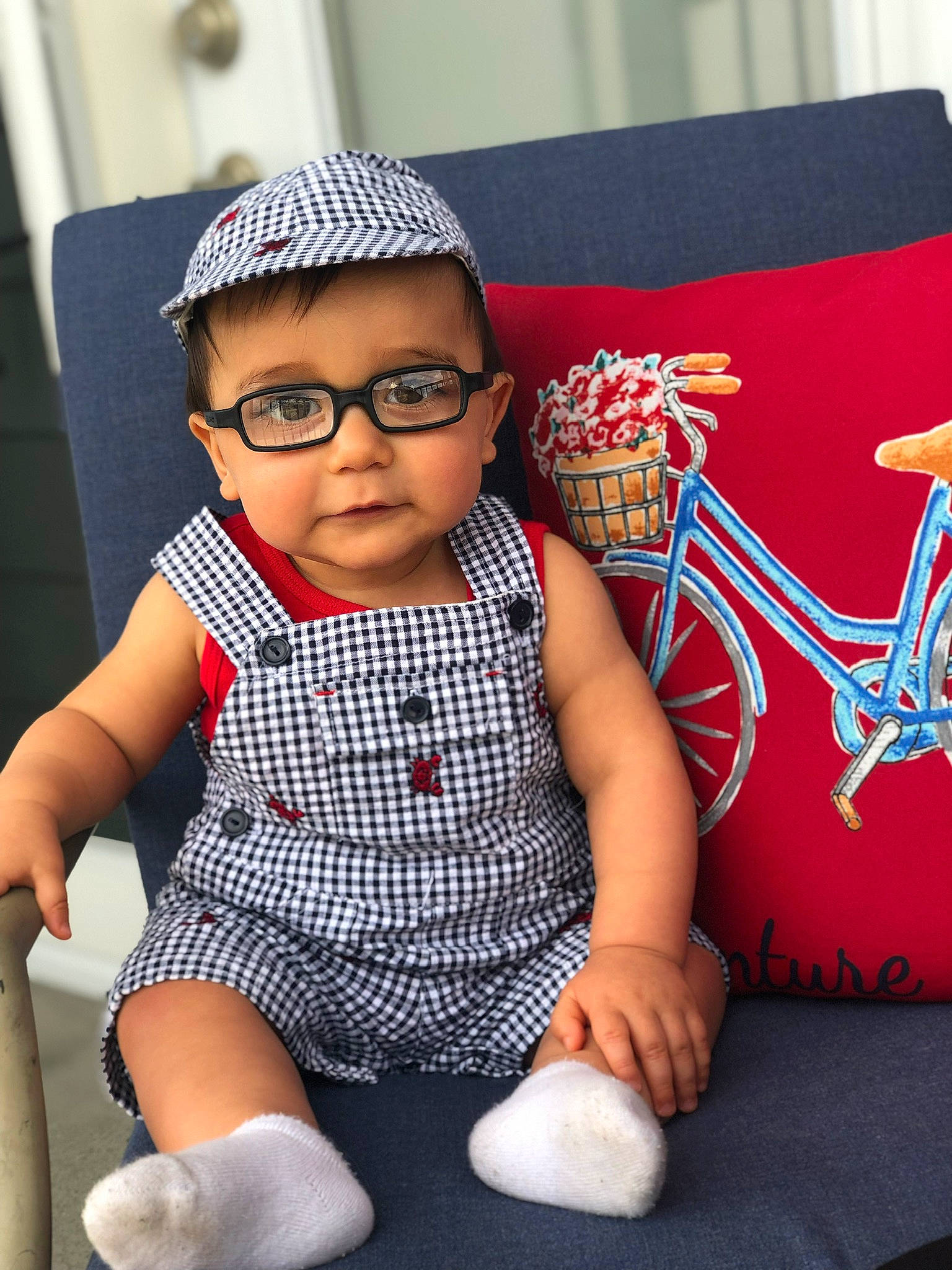 Matthias is registered to the contest to win money with this photo: baby, cap, child, cool, crochet, design, eyewear, glasses, hat, headgear, headwear, knit_cap, knitting, pattern, people, person, sitting, skin, sunglasses, textile