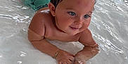 Lyzio participe au concours pour gagner de l'argent avec cette photo : bracelet, child, cute, face, floor_tiles, happy, indoors, person, playful, pool, reflection, shoes, skin, smile, splash, swimwear, toddler, water, wet_hair, young