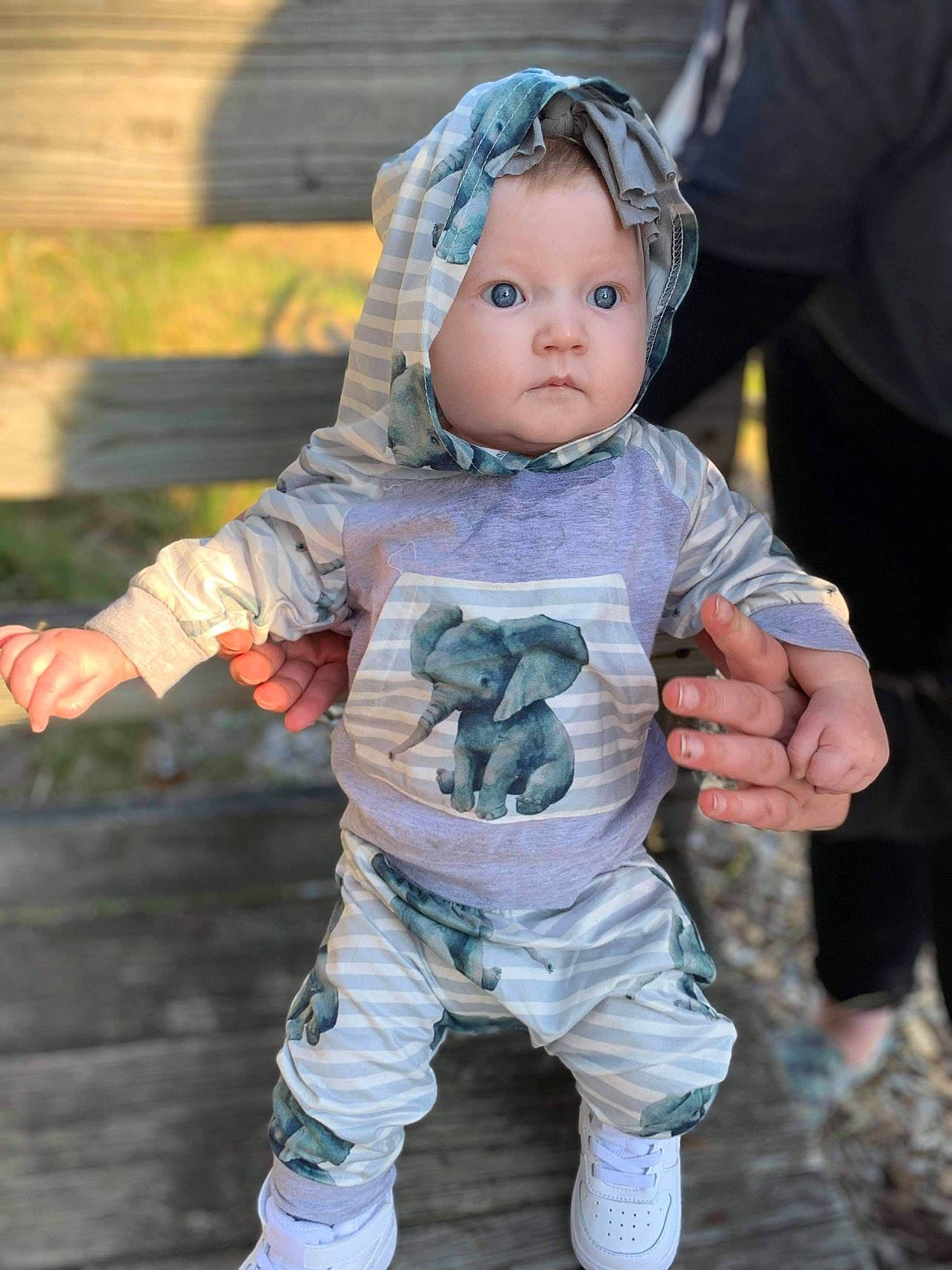 Adilynn joined the competition — help win amazing prizes! baby, baby_toddler_clothing, doll, eye, face, facial_expression, finger, fun, gesture, grass, happy, head, headwear, people_in_nature, person, pink, sitting, skin, sleeve, textile