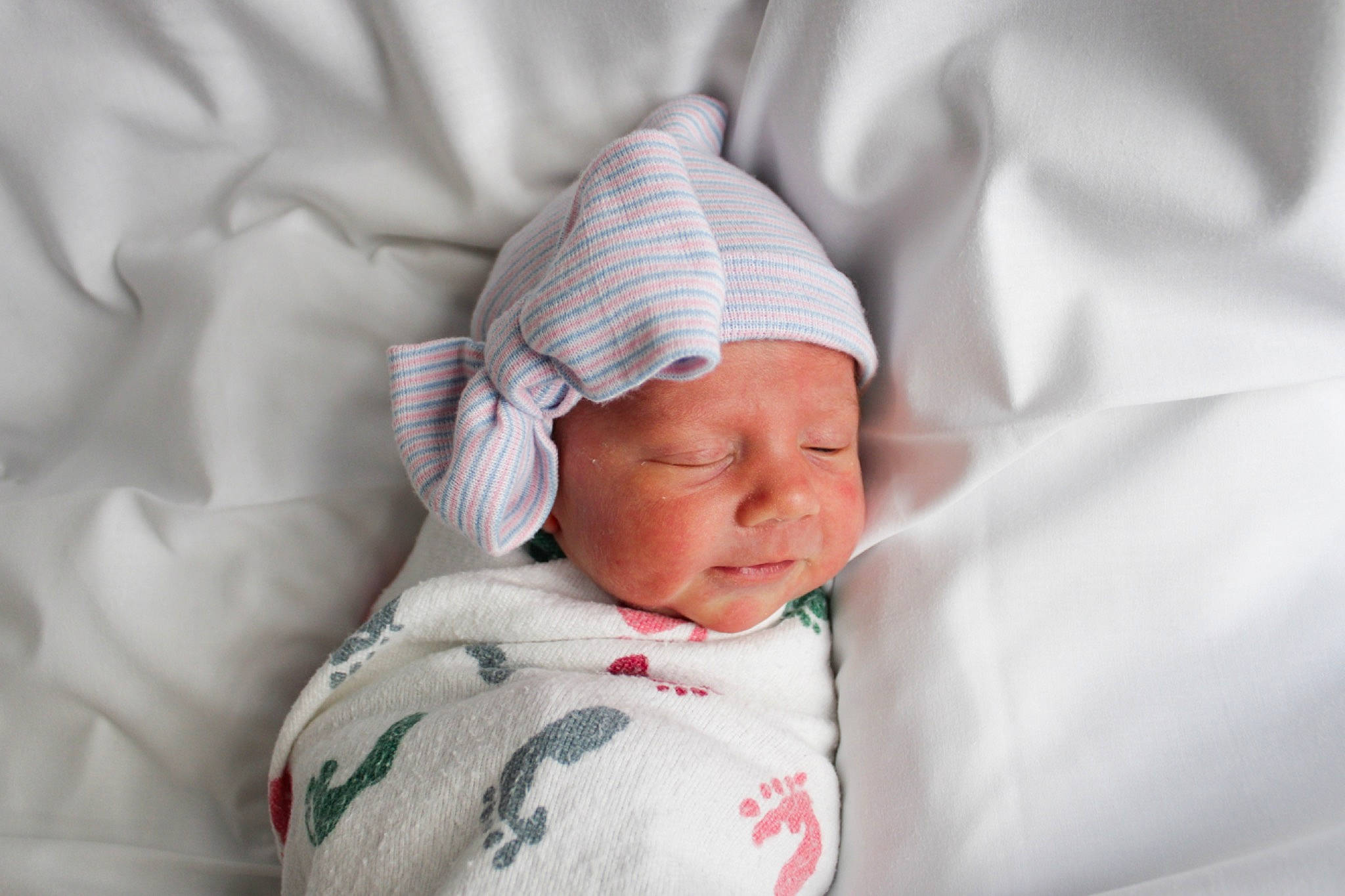 Rayven is registered to the contest to win money with this photo: baby, baby_sleeping, baby_toddler_clothing, carmine, child, comfort, hat, headwear, linens, person, portrait_photography, sleep, sleeve, toddler