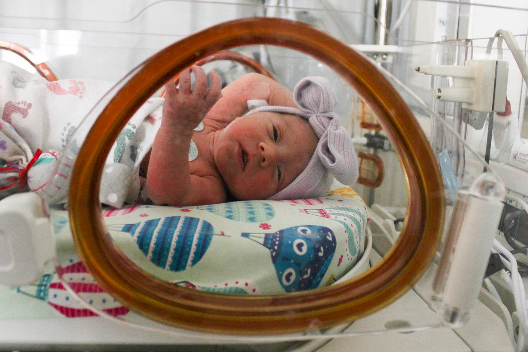 Rayven is registered to the contest to win money with this photo: baby, baby_products, baby_safety, child, circle, comfort, event, headwear, health_care, hospital, linens, medical, medical_equipment, medical_procedure, patient, pediatrics, person, product, room, service