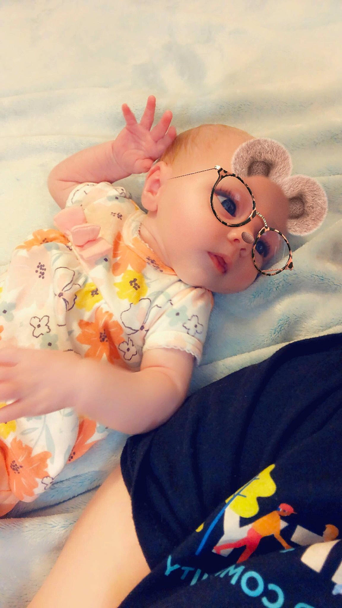 Lillian is registered to the contest to win money with this photo: abdomen, baby, baby_toddler_clothing, eye, eyewear, finger, fun, glasses, hand, happy, hat, head, headgear, human_body, iris, mouth, orange, person, pink, skin