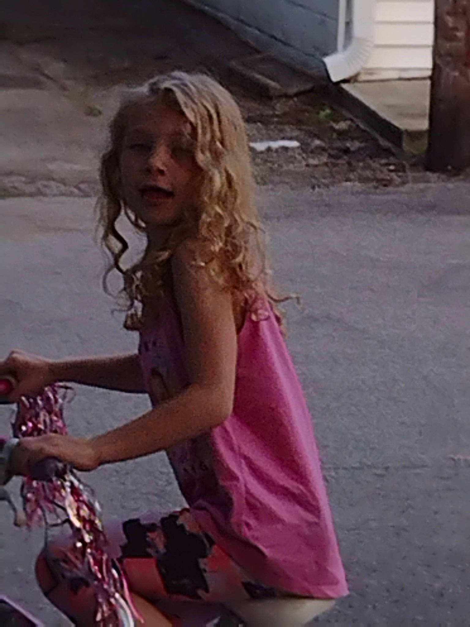 Leslie joined the competition — help win amazing prizes! asphalt, blond, brown_hair, eyewear, fun, happy, human_leg, leisure, long_hair, magenta, motor_vehicle, person, pink, recreation, road, road_surface, sidewalk, sitting, street, thigh