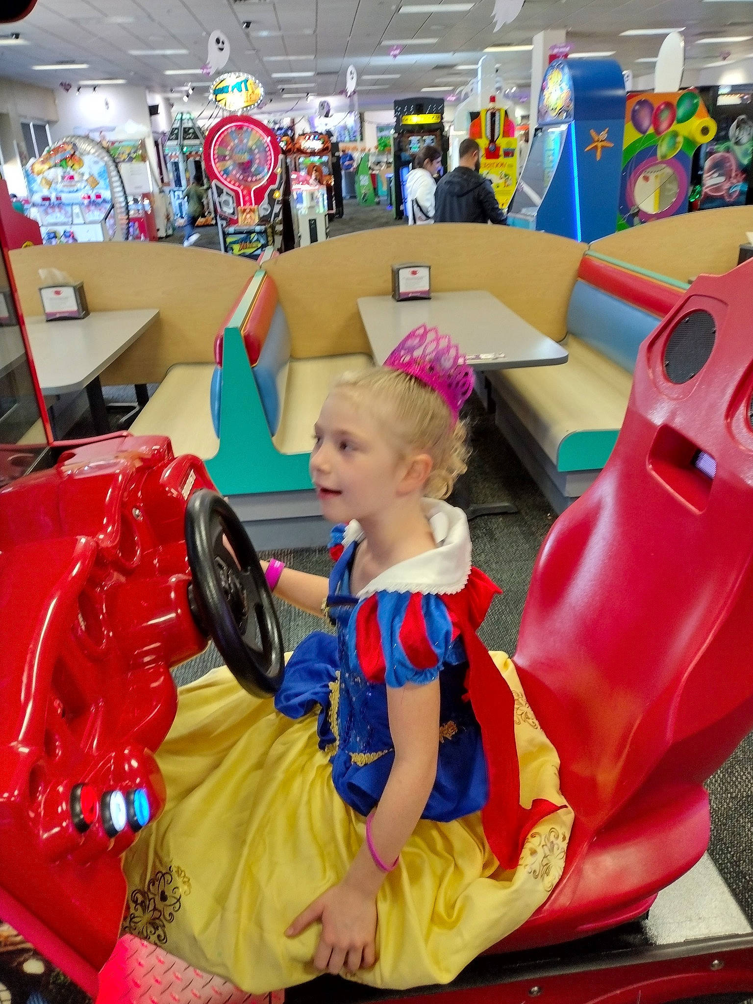 Leslie is registered to the contest to win money with this photo: automotive_design, building, chair, child, event, fictional_character, fun, games, hat, inflatable, leisure, person, photograph, play, recreation, room, shoe, snapshot, toddler, travel