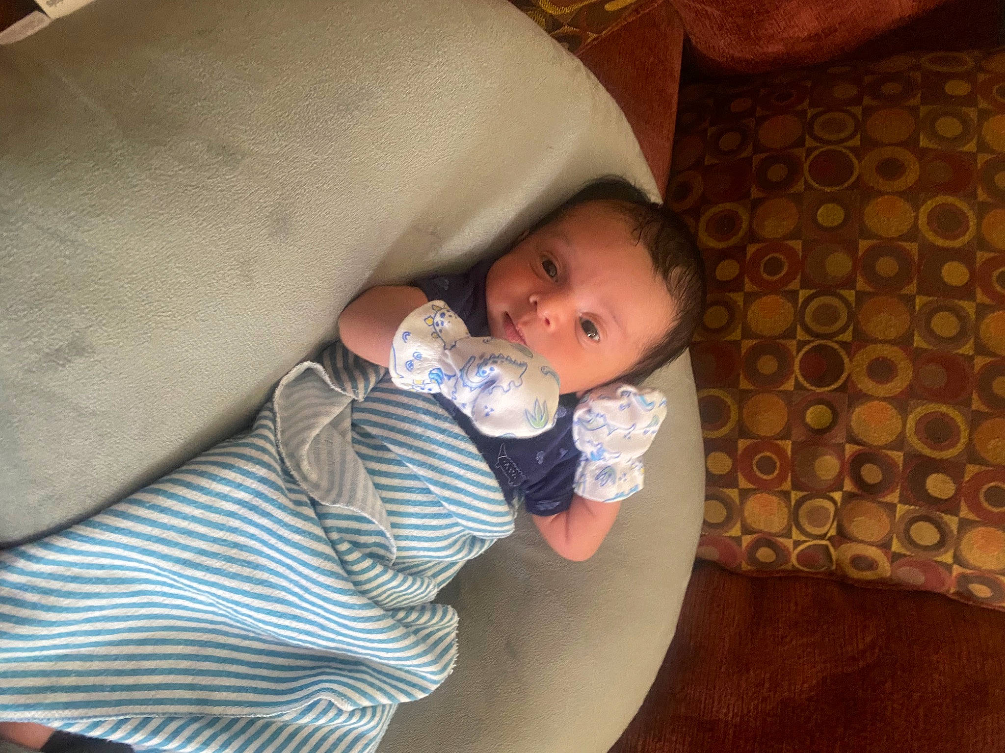 Jon is registered to the contest to win money with this photo: baby, baby_bottle, baby_products, baby_toddler_clothing, bottle, cheek, child, comfort, drinkware, finger, helmet, linens, mouth, nail, person, plastic_bottle, room, sitting, skin, thumb