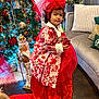 baby, christmas, christmasdecorations, clothing, coat, costume, couch, dress, face, fashion, festival, formalwear, furniture, gown, hair, head, person, photography, plant, portrait