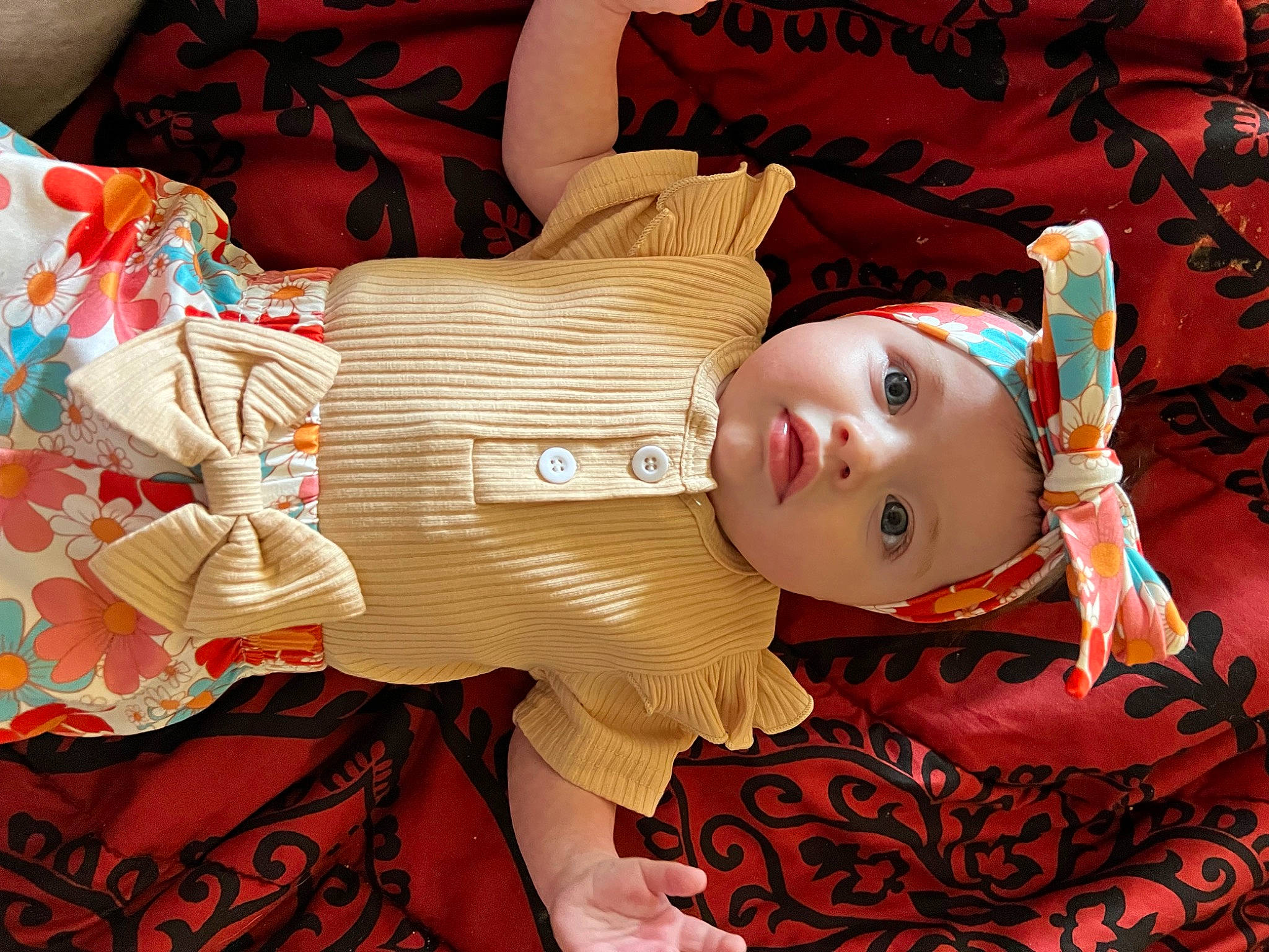 Athena is registered to the contest to win money with this photo: carmine, cheek, child, doll, eyelash, flesh, happy, head, headwear, human_body, pattern, peach, person, rose, textile, toy, visual_arts, wood