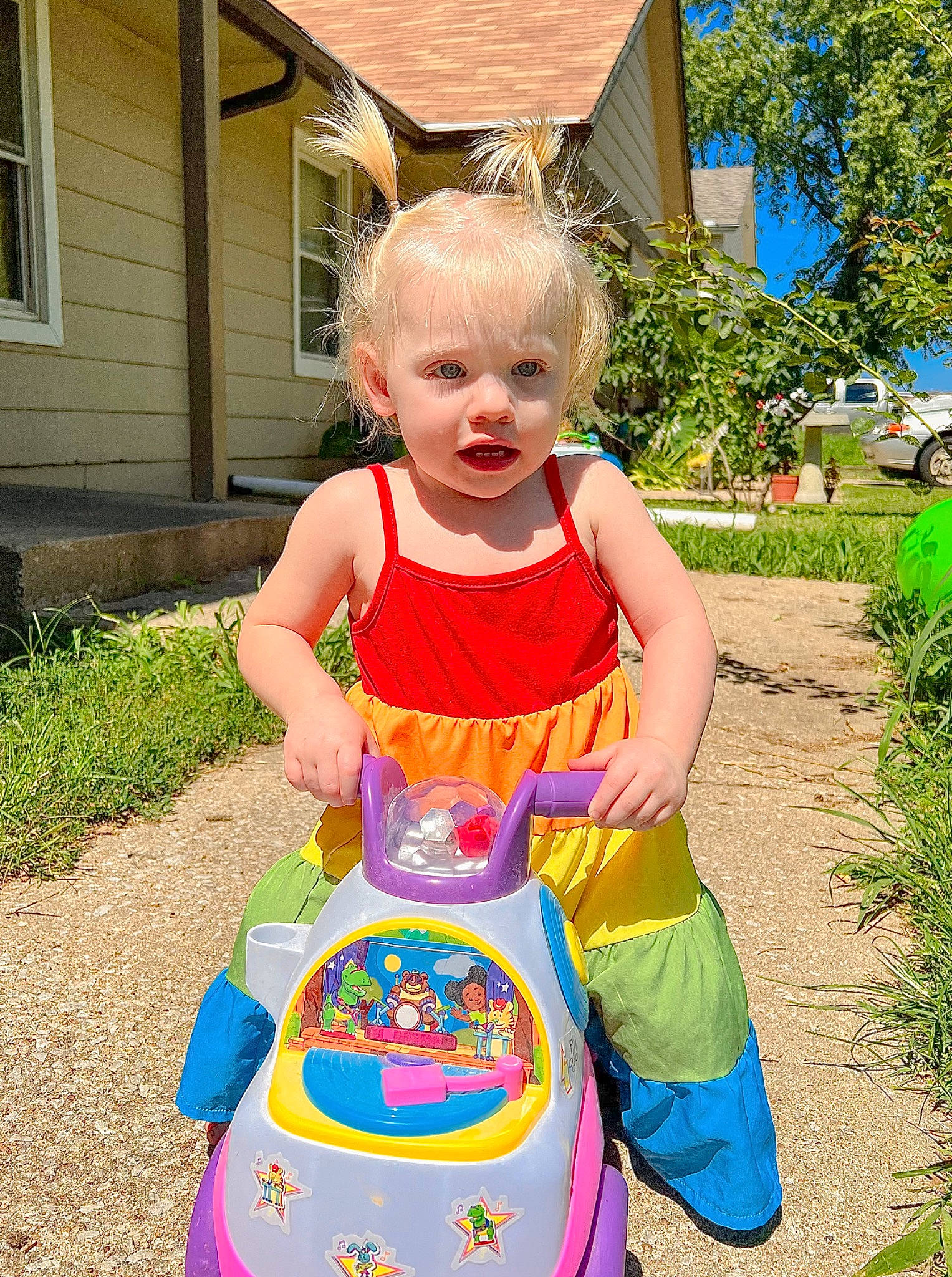 Hailey joined the competition — help win amazing prizes! baby_toddler_clothing, child, fun, garden, grass, happy, house, leisure, magenta, person, pink, plant, play, recreation, riding_toy, siding, smile, summer, toddler, tree