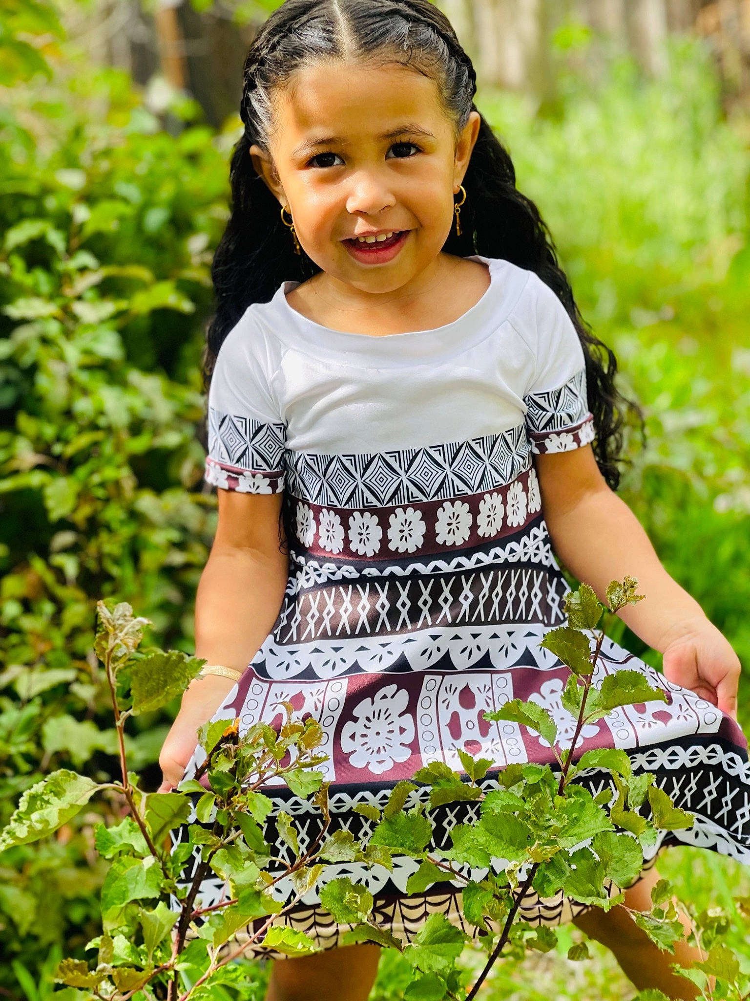 Kailani is registered to the contest to win money with this photo: baby_toddler_clothing, beauty, botany, child, day_dress, face, grass, groundcover, happy, joy, one_piece_garment, pattern, people_in_nature, person, plant, sleeve, sleeveless_shirt, smile, spring, summer