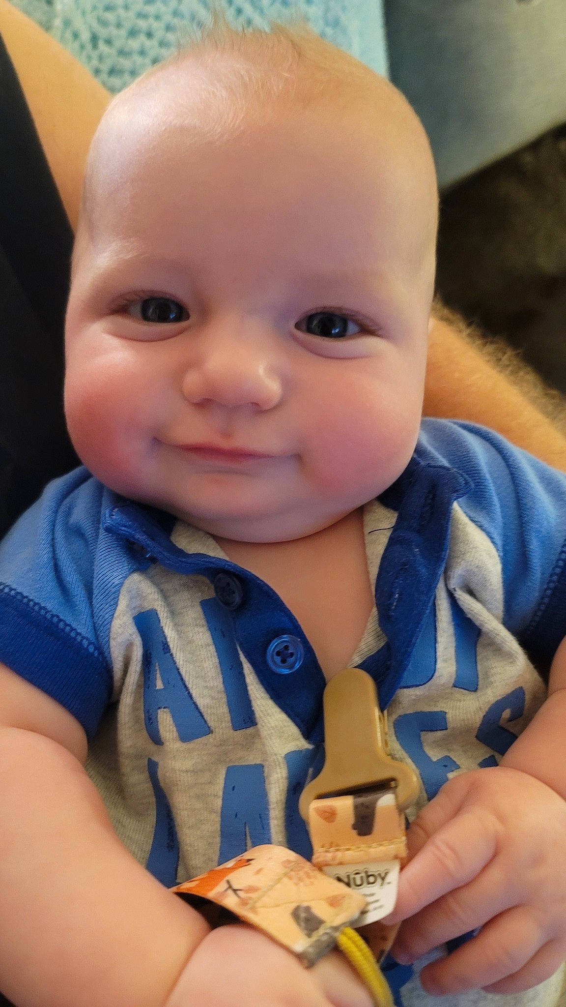 Lucas is registered to the contest to win money with this photo: arm, baby, baby_toddler_clothing, cheek, child, chin, eyebrow, finger, hand, happy, iris, lip, mouth, nail, nose, person, skin, sleeve, smile, thumb