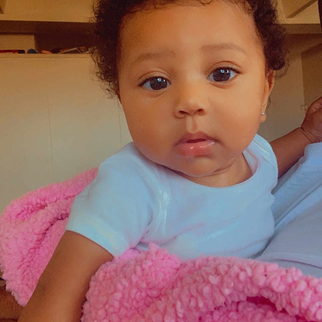 Skylar joined the competition — help win amazing prizes! baby, blanket, bodypart, clothing, couch, crib, face, finger, furniture, hand, head, homedecor, indoors, infantbed, newborn, person, photography, portrait, t_shirt, towel