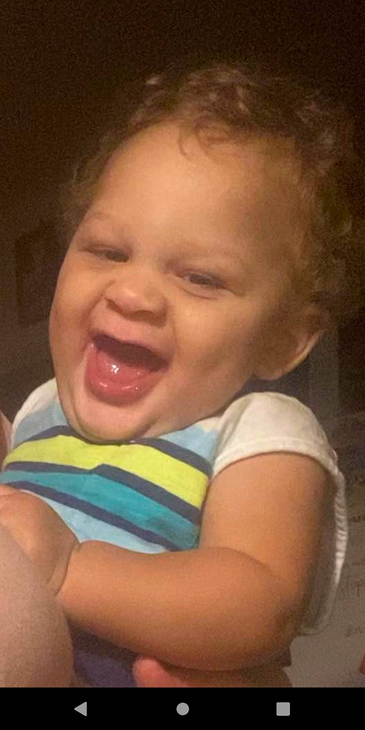 Julian is registered to the contest to win money with this photo: arm, baby, baby_laughing, cheek, ear, eyebrow, flash_photography, forehead, fun, gesture, happy, iris, lip, mouth, neck, nose, person, skin, smile, toddler